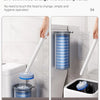 A hand uses a rainbow button to easily change the head of a disposable toilet brush for hygienic operation.