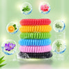 A display of ten natural mosquito repellent bracelets in various colors, including green, orange, pink, and black, shown floa