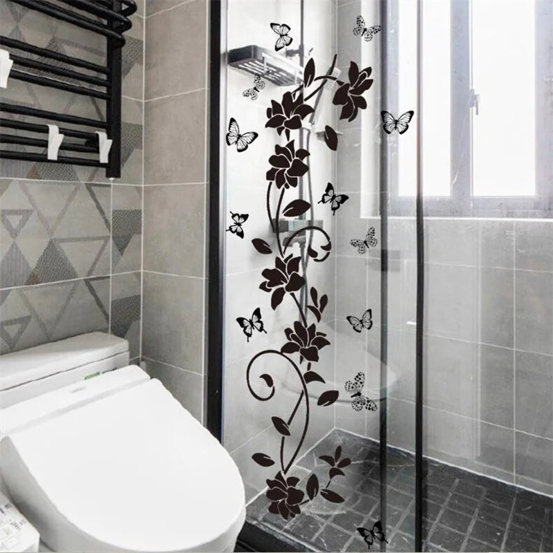 Decorative flower butterfly wall stickers on a glass shower door in a bathroom setting