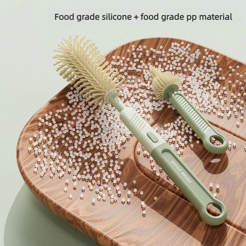 A set of food grade silicone and PP bottle brushes with natural bristles displayed on a wooden surface.