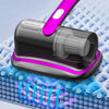 A handheld mattress vacuum cleaner with a purple handle and black body is shown cleaning a textured surface.