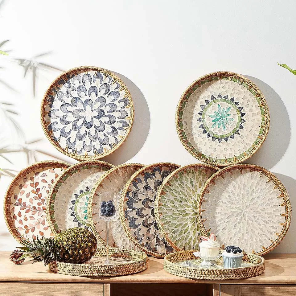 Round rattan serving tray with mother of pearl inlay featuring various decorative patterns.