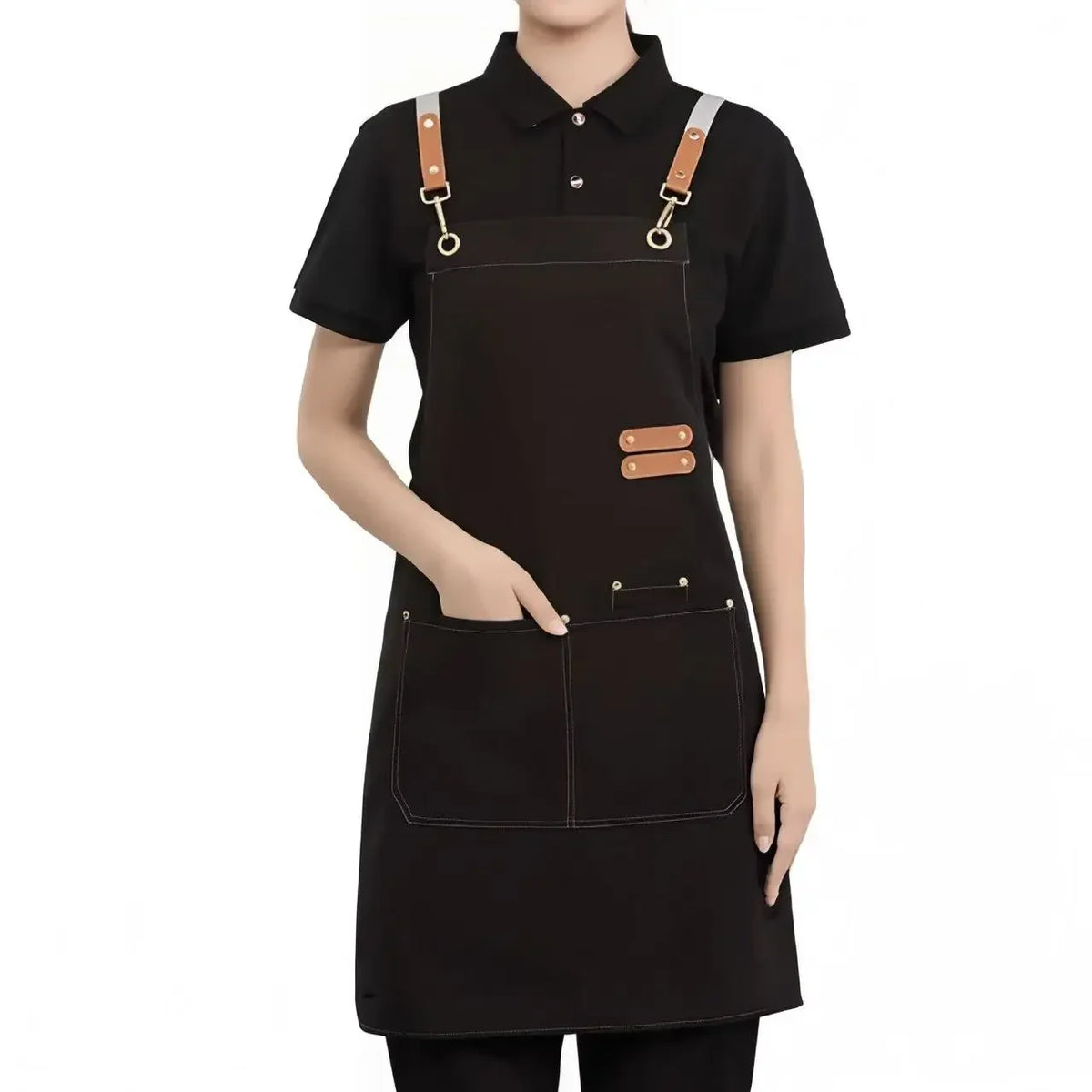 A professional black adjustable hairdressing apron with leather straps and pockets