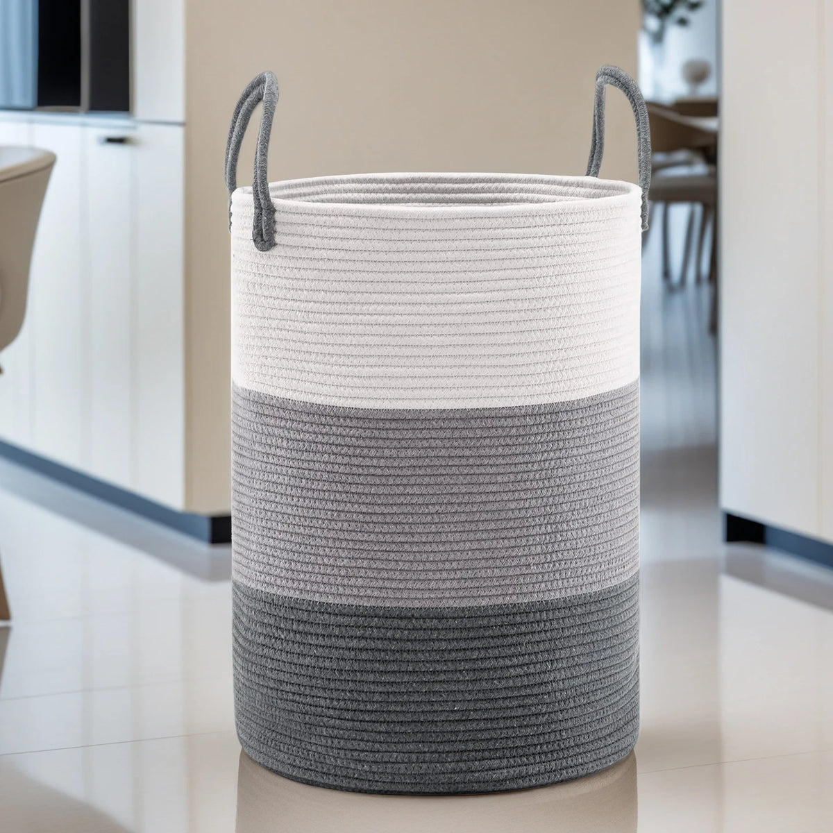 Large woven storage hamper in striped gray and off-white with handles