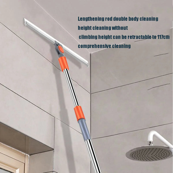 A silver and orange silicone squeegee broom with an aluminum handle is shown cleaning a ceiling.
