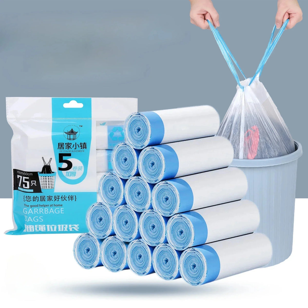 A stack of five white and blue scented drawstring trash bags is shown next to a plastic container.