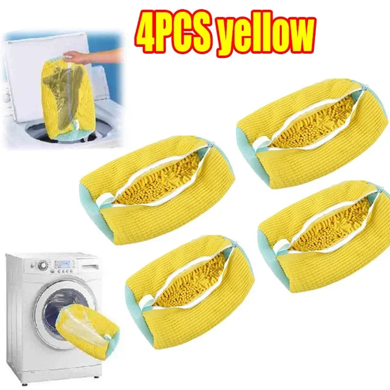 Four yellow laundry bags for shoes shown next to a washing machine.