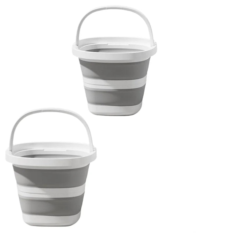 A gray and white collapsible water bucket with a handle shown from the side.