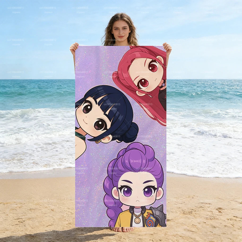 A woman holds up a vertical poster featuring glitter purple chibi anime characters against a beach background.