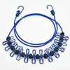 Blue adjustable elastic clothesline with black clips and loops for outdoor drying