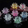 A collection of crystal lotus flower tabletop decor in various colors including yellow, pink, and blue
