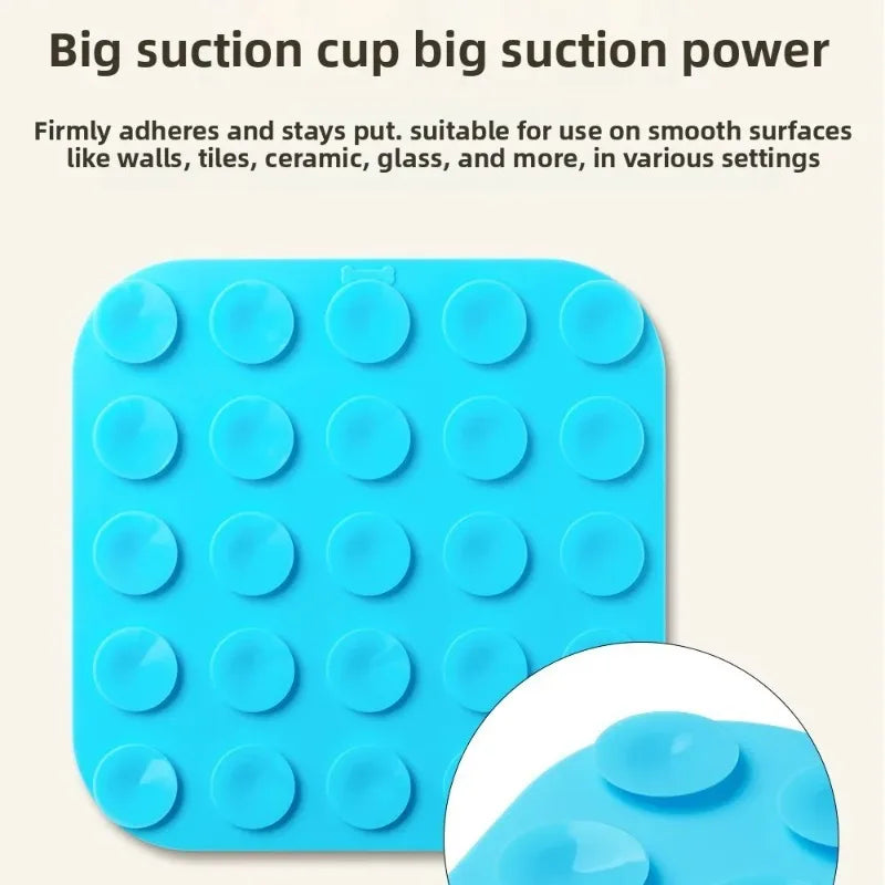 A blue silicone suction cup mat with multiple circular pads for use on smooth surfaces.