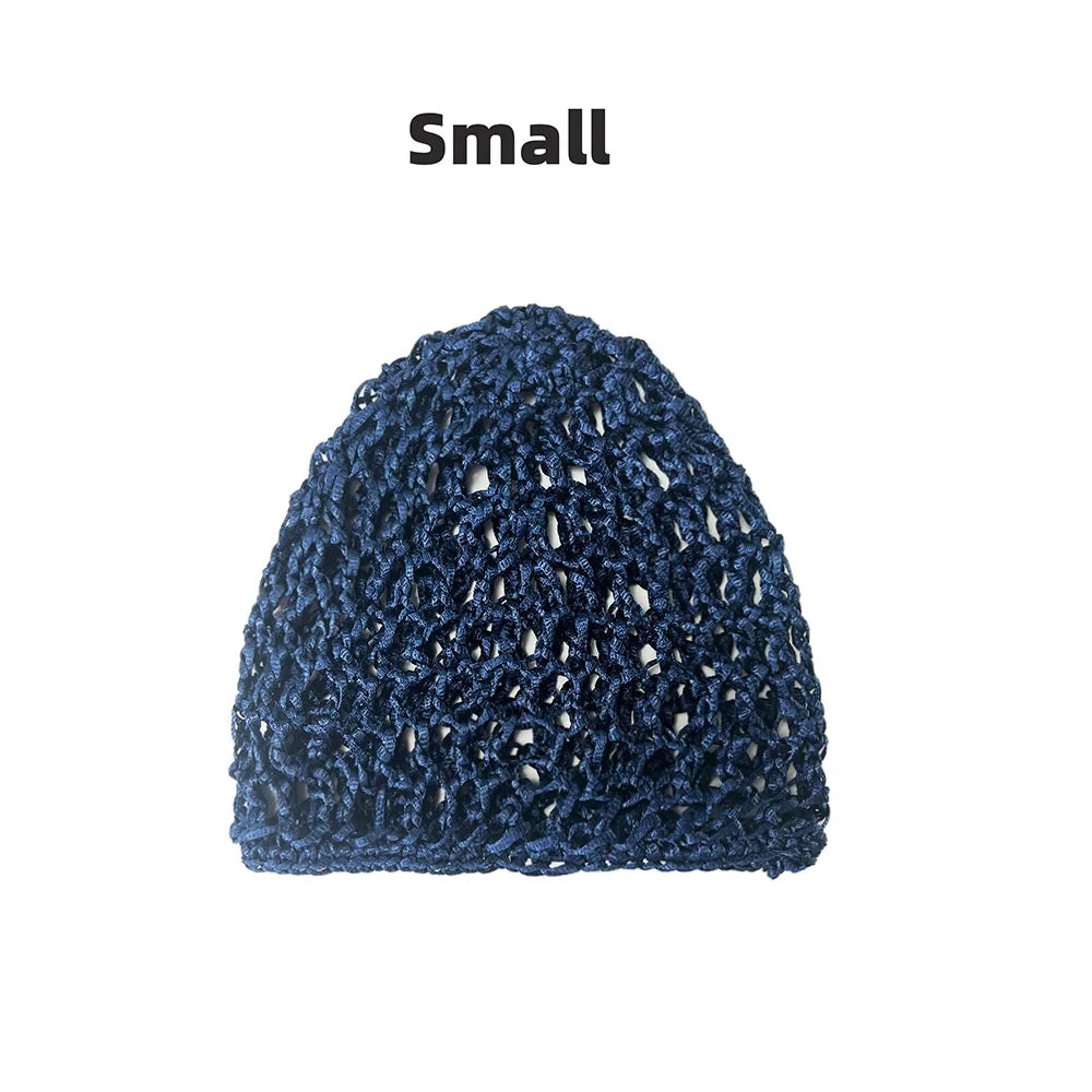 A small, dark blue hand-crocheted mesh hair net cap.