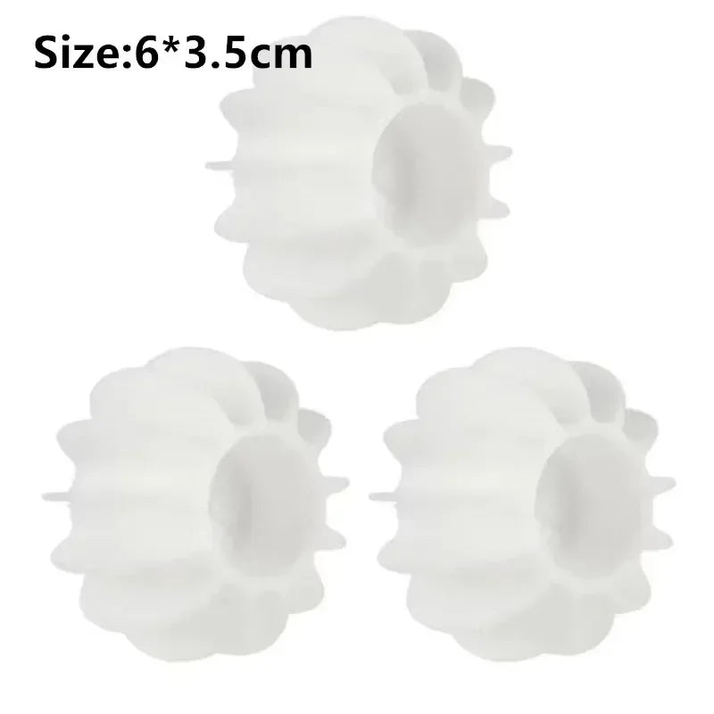 Two white reusable laundry balls designed for pet hair and lint removal