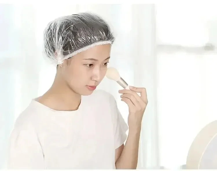 A person is using a reusable disposable shower cap for hair protection.