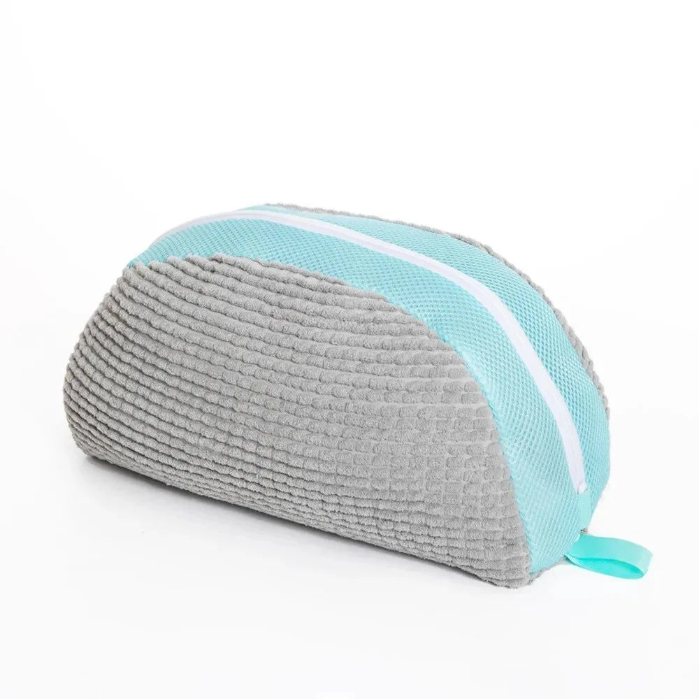 A grey and light blue multi-use shoe cleaning set with brushes and a storage bag.