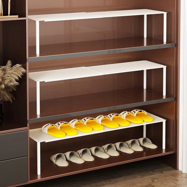 A wooden shoe cabinet organizer with multiple shelves displaying various pairs of shoes.