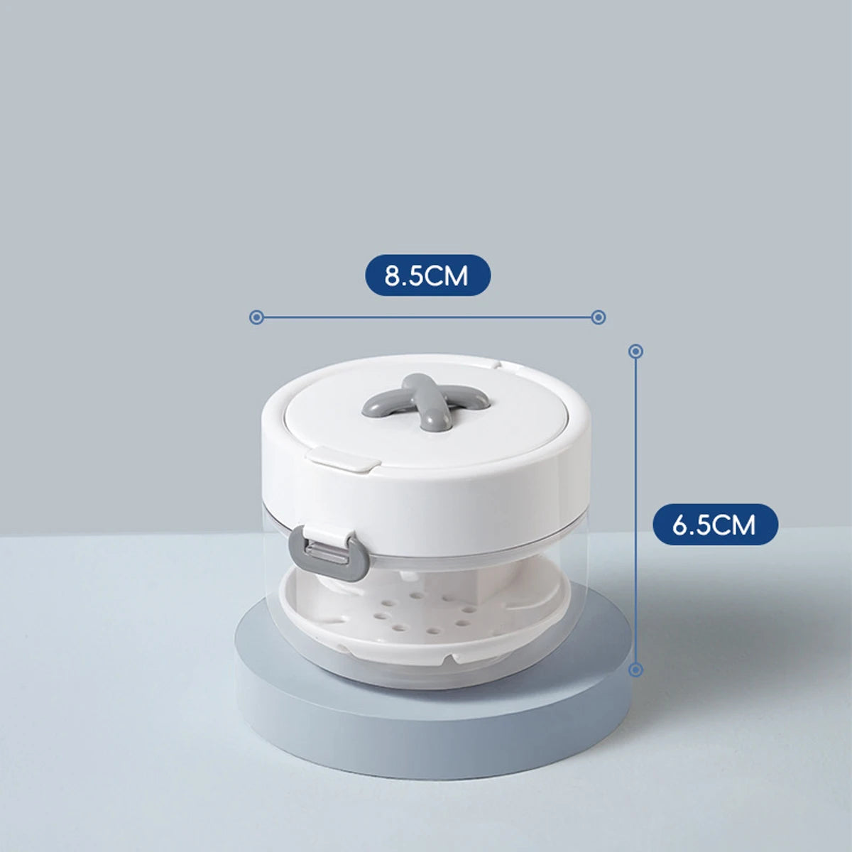 A white portable multi-tool organizer for dental appliances shown from above with dimensions 8.5cm and 6.5cm.