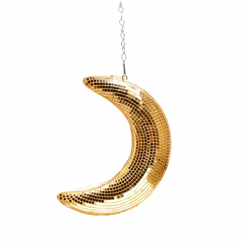 A gold-colored mosaic moon pendant hanging from a chain.