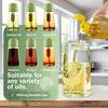 A set of oil spray bottles, including soybean oil, olive oil, peanut oil, and vinegar, are shown next to a glass bottle fille