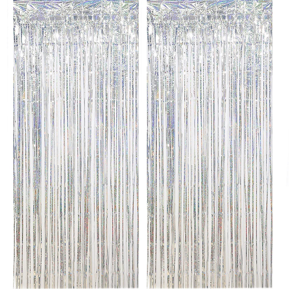 A vertical curtain backdrop made of rose gold foil tinsel fringe strands.