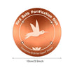 A round copper bird bath purification disk with a dove silhouette and chemical-free coating.