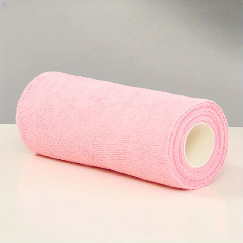 A roll of pink reusable microfiber cleaning cloths.