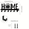 Black rustic metal wall hook key holder with a decorative flower design and assembly set.