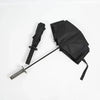 A black folding katana sword umbrella with a black sheath and blade is displayed on a white background.