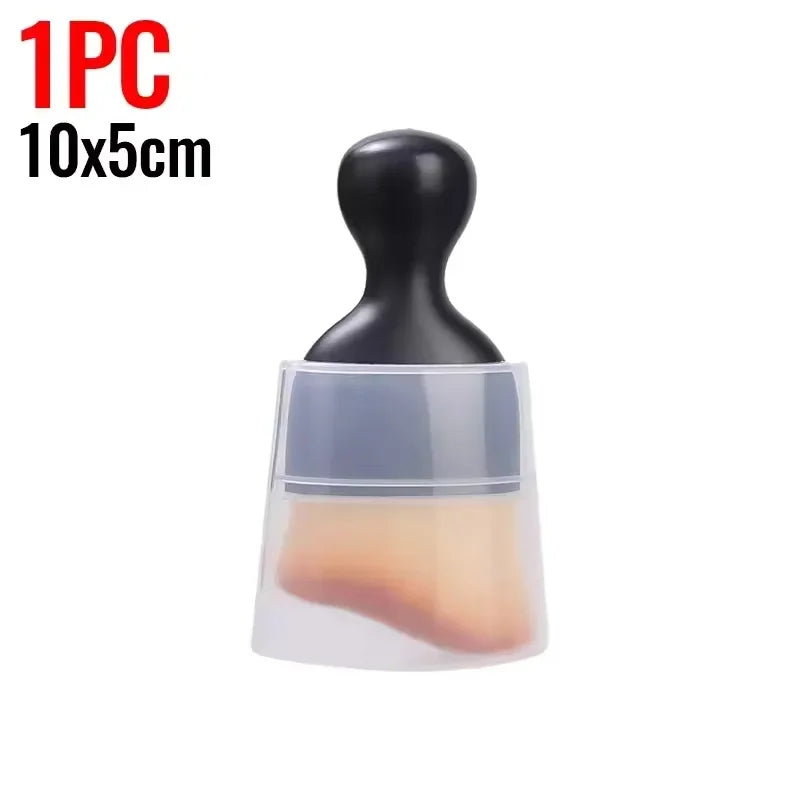A single black silicone cleaning brush with a clear plastic base and an orange-tinted cleaning pad.