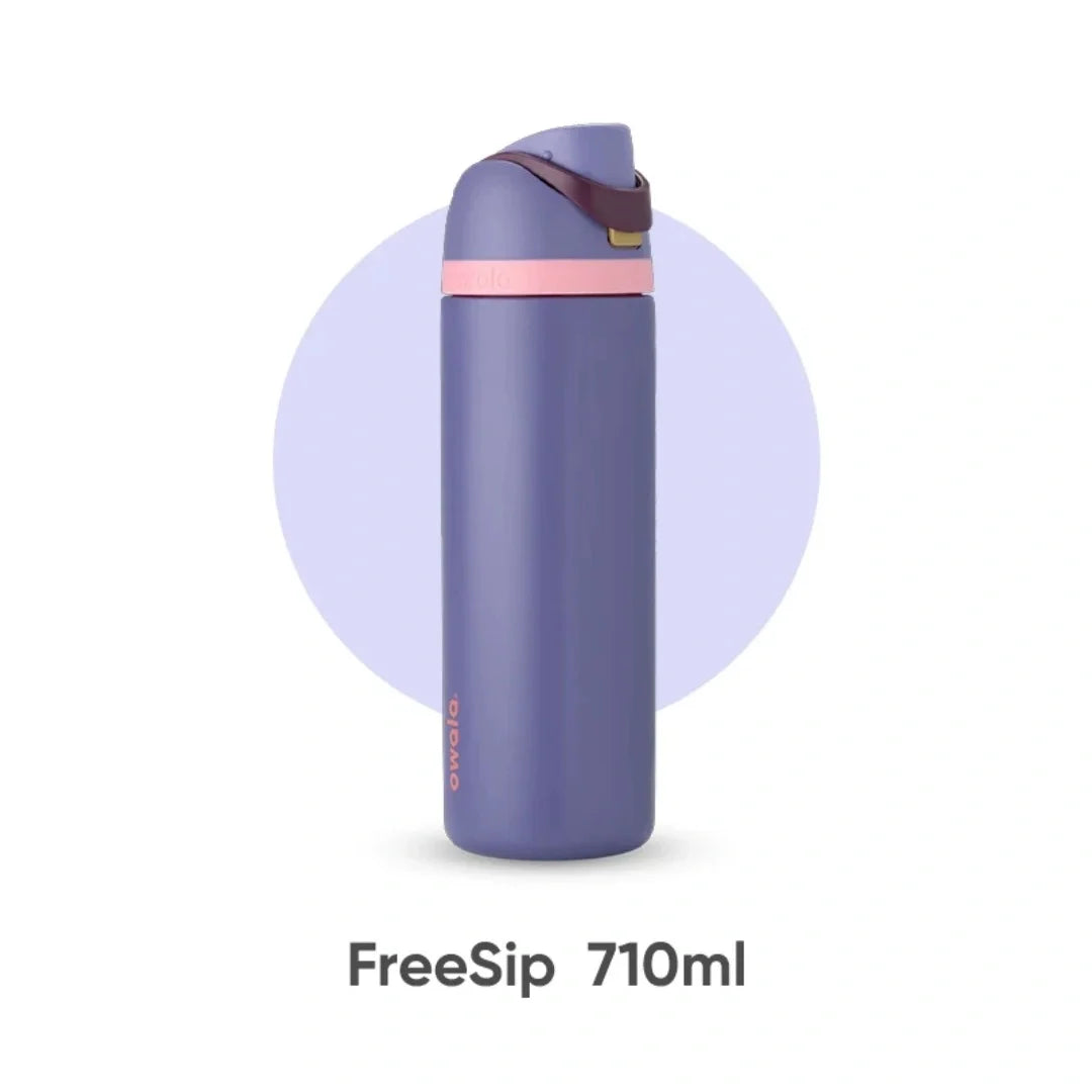 A purple FreeSip 710ml insulated water bottle with a silicone cap is shown standing upright.