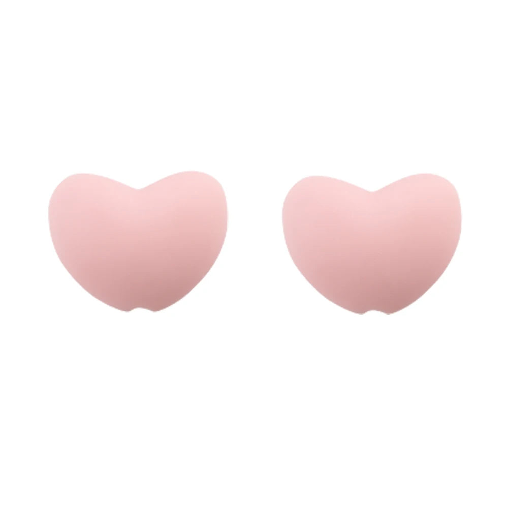 A pair of pink silicone heart charm beads for DIY jewelry.