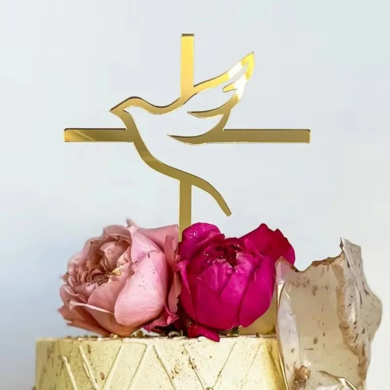 Gold acrylic cross cake topper featuring a silhouette of a dove and a cross on a cake.