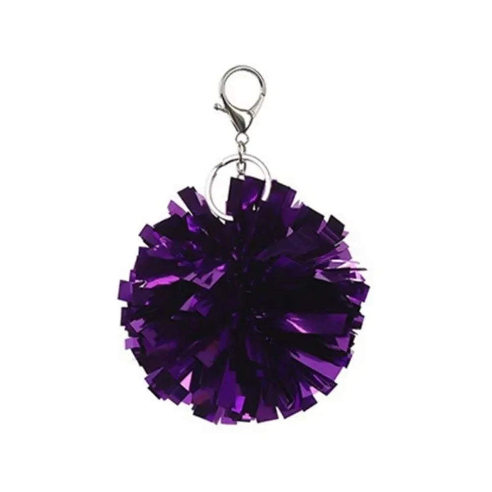 Lila irisierende Pom-Pom-Anhänger mit silbernem Ring.