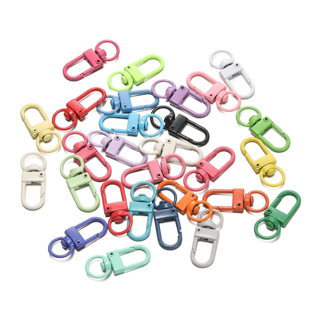 A collection of colorful alloy snap lobster clasp hooks and jewelry findings for crafting