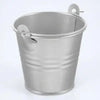 A vintage galvanized iron flower bucket with a lid, used for home decor.
