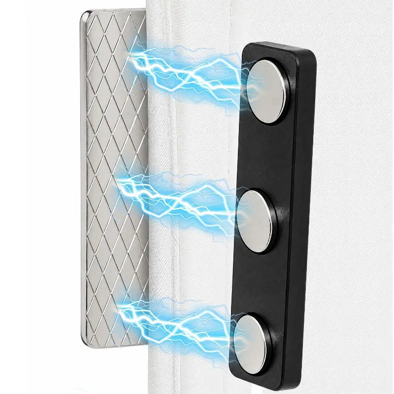 Black magnetic curtain clips with blue electrical sparks demonstrating strong adhesive backing.