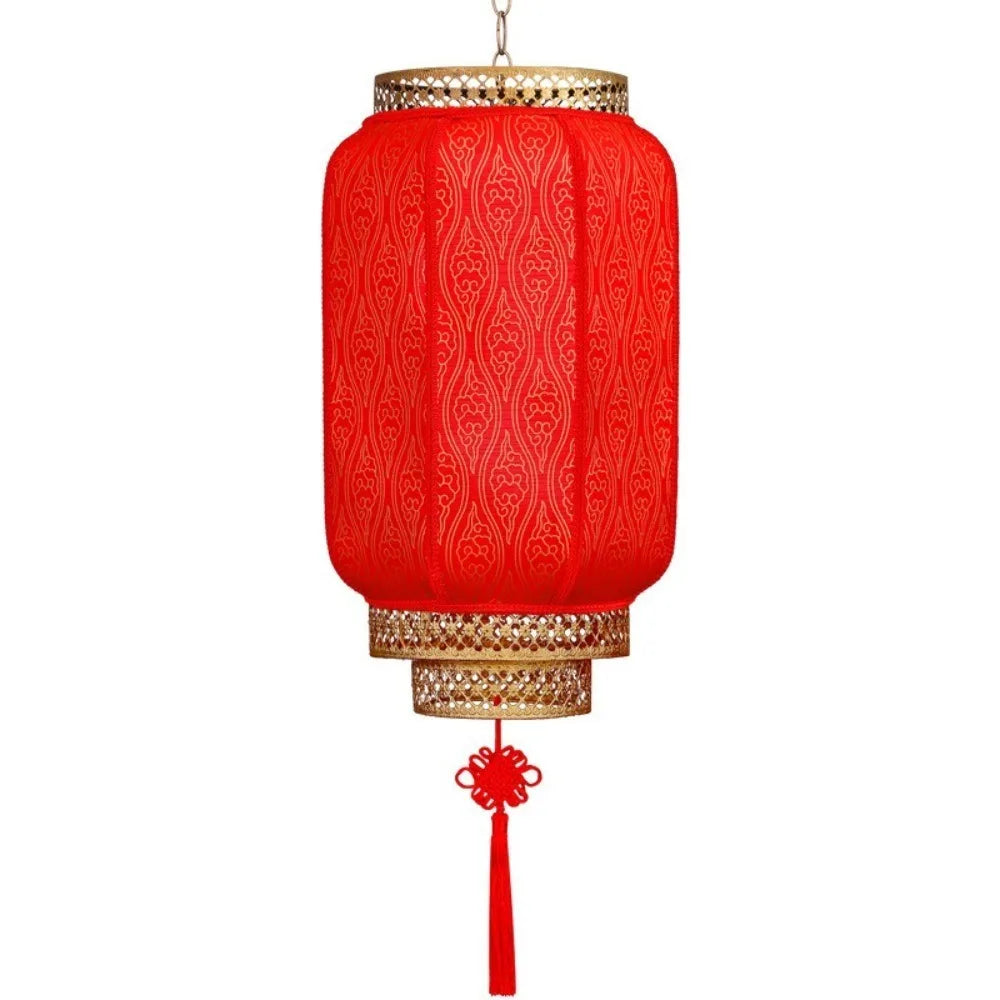 A durable antiqued red Chinese lantern with gold accents, hanging from a cord.