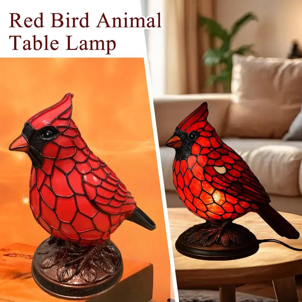 A decorative resin red bird table lamp featuring a detailed, glossy red bird sculpture.