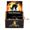 A wooden box featuring a Halloween themed illustration of a black cat against an orange background.