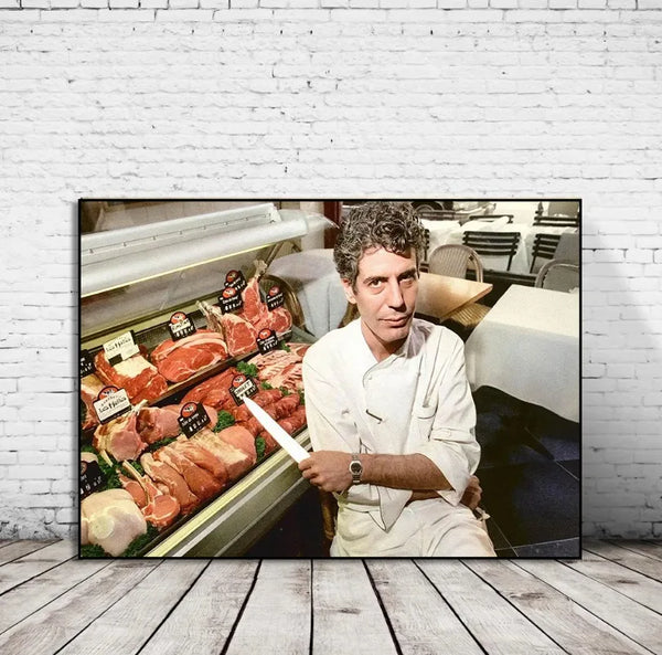 A man in a white shirt is featured in a canvas wall art print showing various cuts of meat on a display tray.