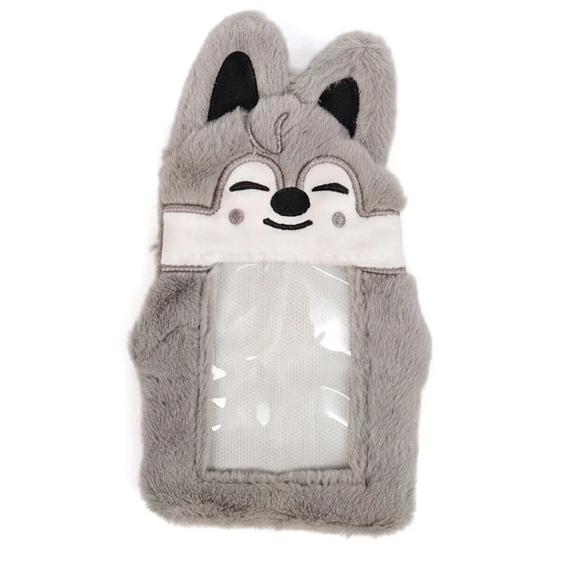 A gray plush fox-shaped storage bag with white accents and black ears.