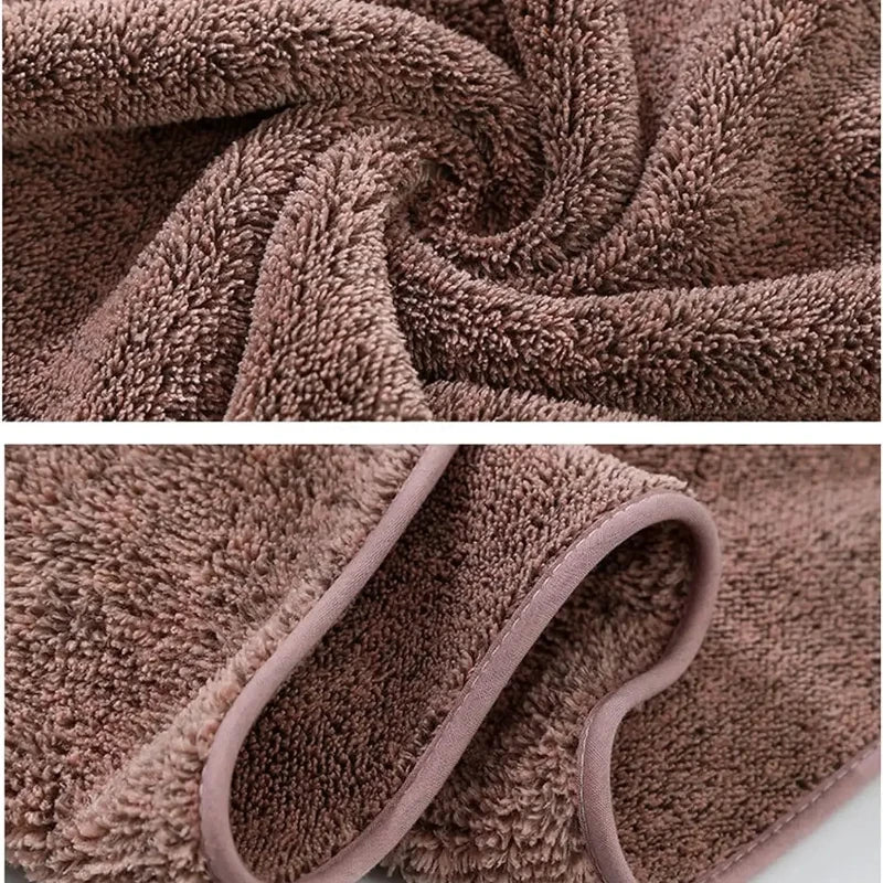 A close-up of a brown, fluffy bath wrap towel being tightly rolled.