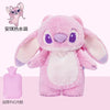 A pink plush toy resembling a cartoon rabbit, packaged with a pink bottle.