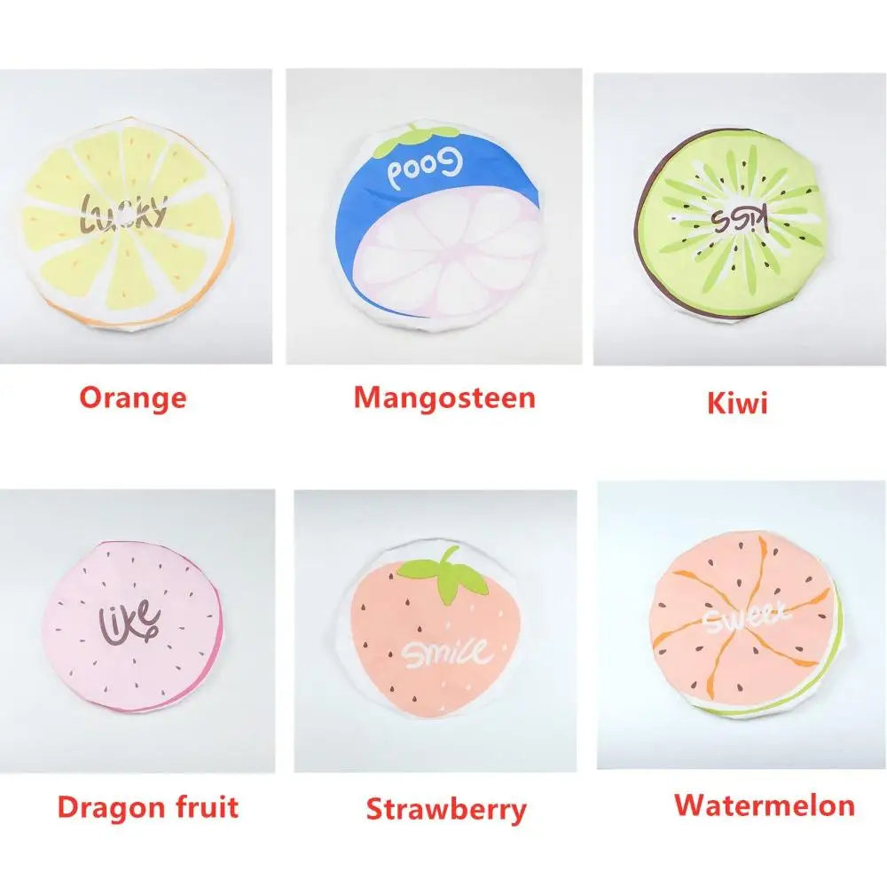 A collection of reusable fruit shower caps featuring various fruits like orange, mango, kiwi, dragon fruit, strawberry, and w