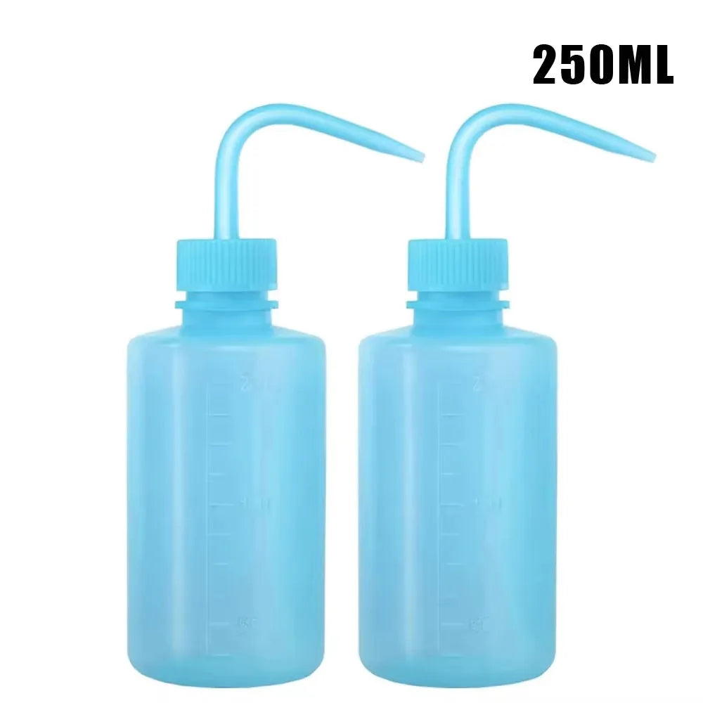 A pair of 250ml squeeze bottles with measurement marks for tattoo solutions in light blue.