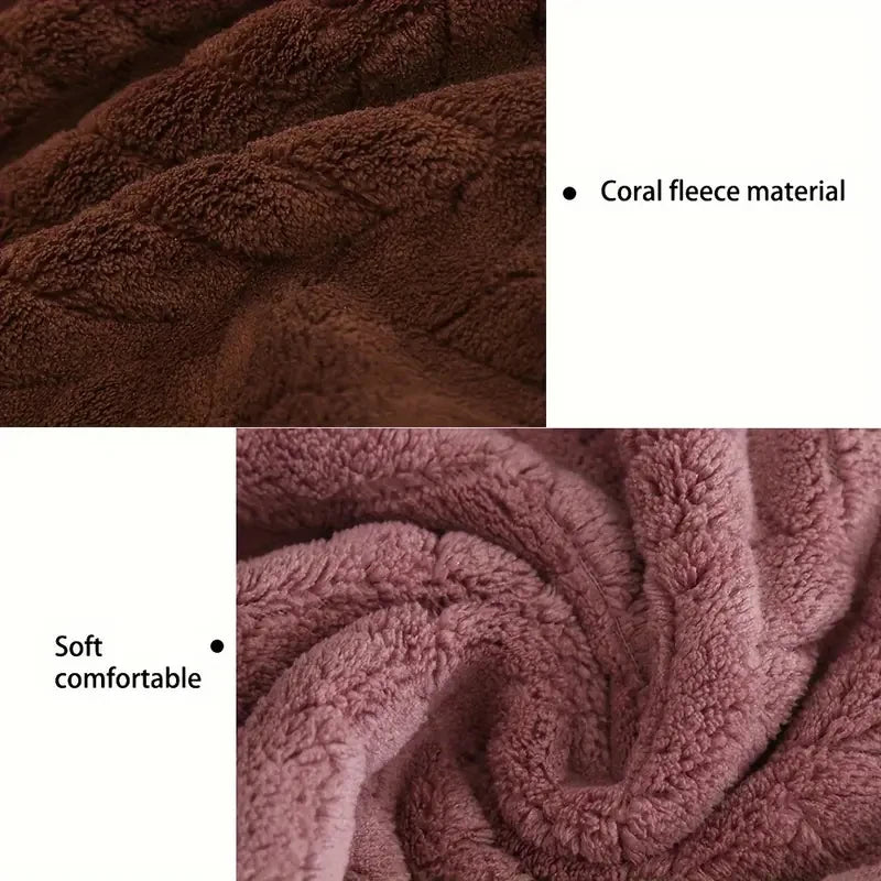 Close-up of a deep coral fleece bath towel showing soft texture and rich brown color.