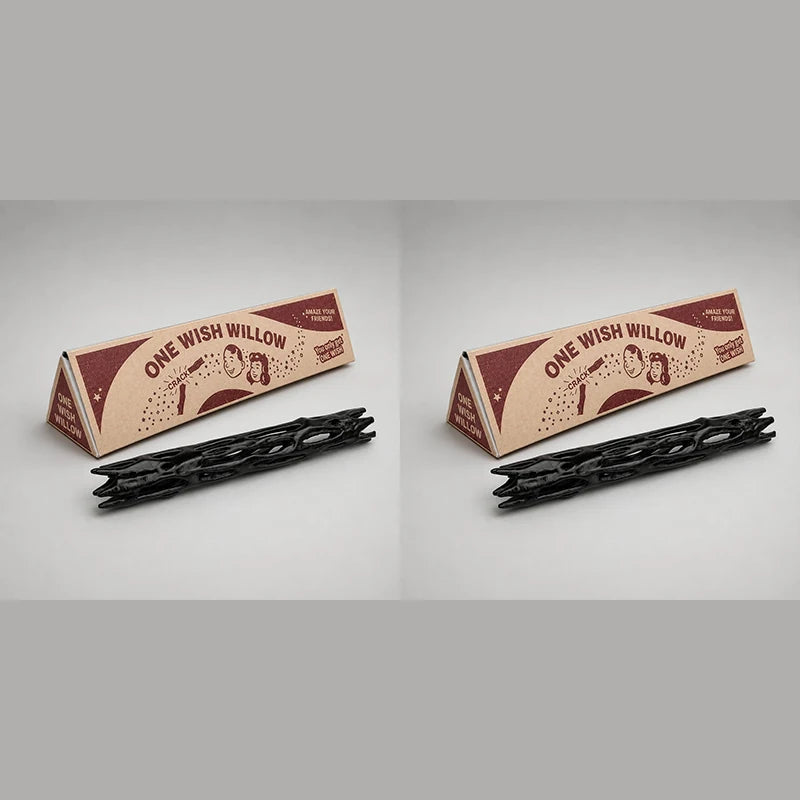 Two wooden sticks labeled One Wish Willow are shown next to black sticks for a night light projector.