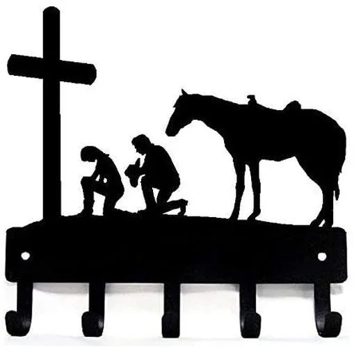A black decorative metal key holder rack with hooks is shown against a white background.