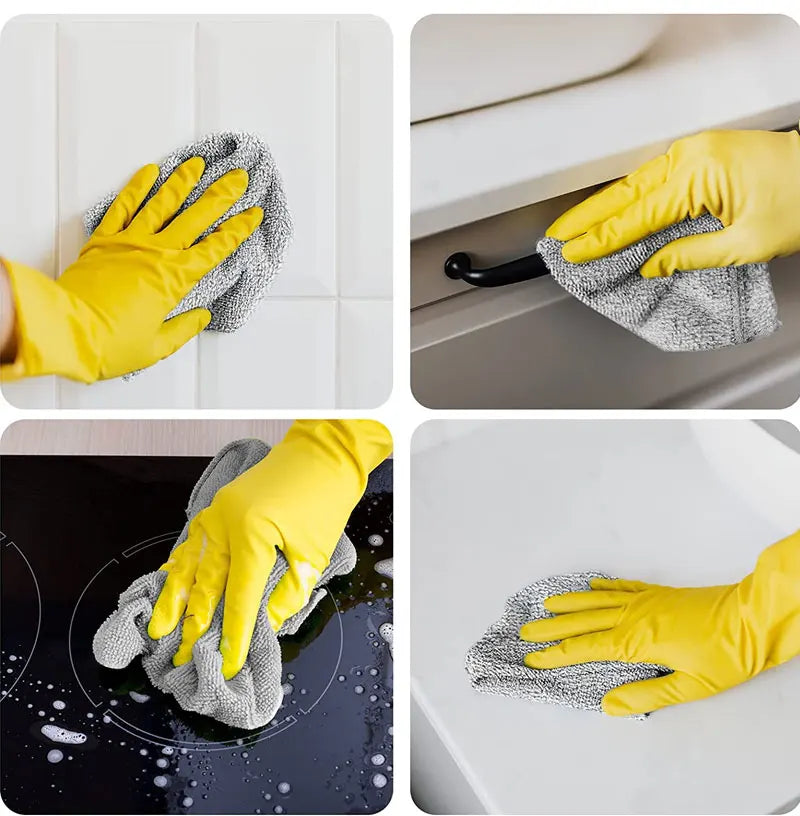 Gelbige Handschuhe reinigen eine Spüle mit grauen Mikrofasertüchern.